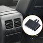 Black car AC vent grille paddle insert detail, ridged panel and side prongs