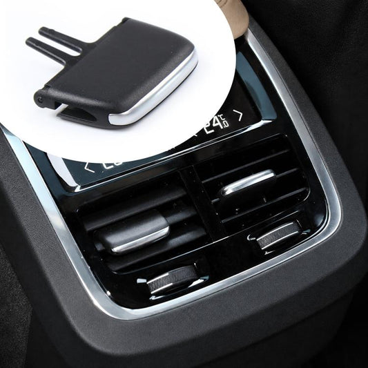 Black air vent paddle shifter insert, close-up on center dashboard vent
