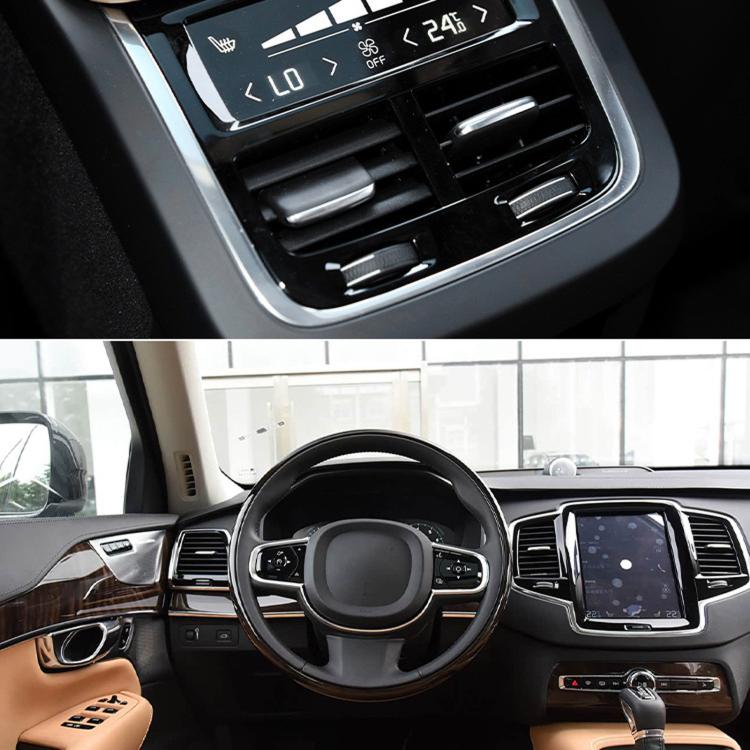 Black air vent paddle shifter trim on dashboard beside infotainment screen