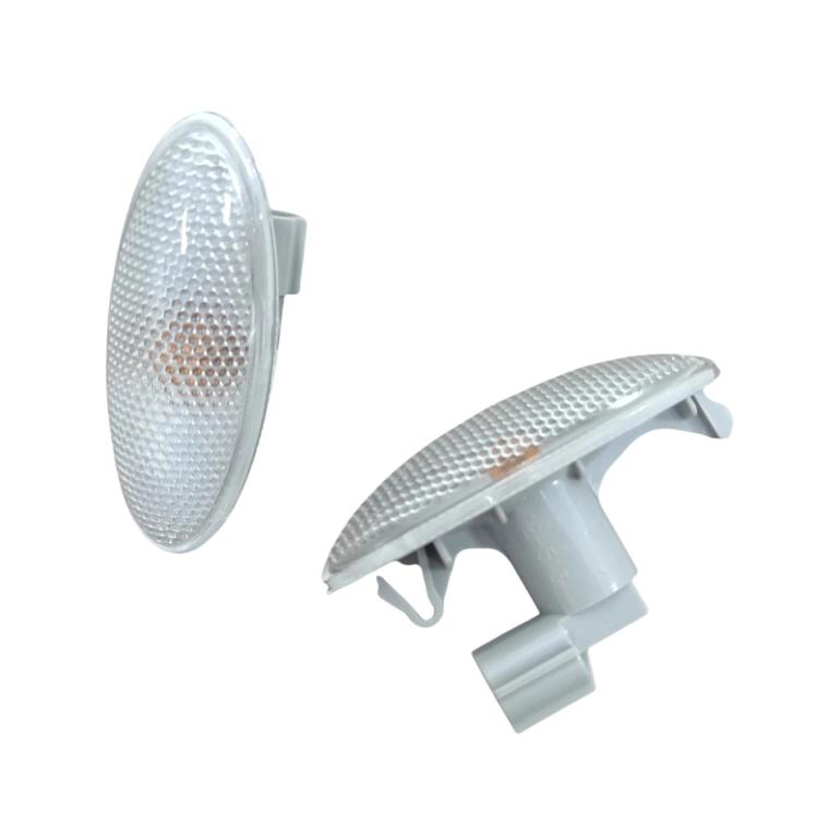 Car turn signal light with clear textured oval lens and gray mounting clips