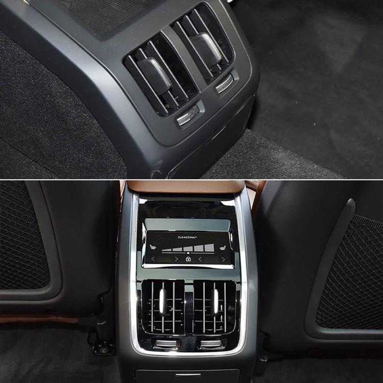 Dashboard air vent adjustment paddle covers over silver-edged air vent panel