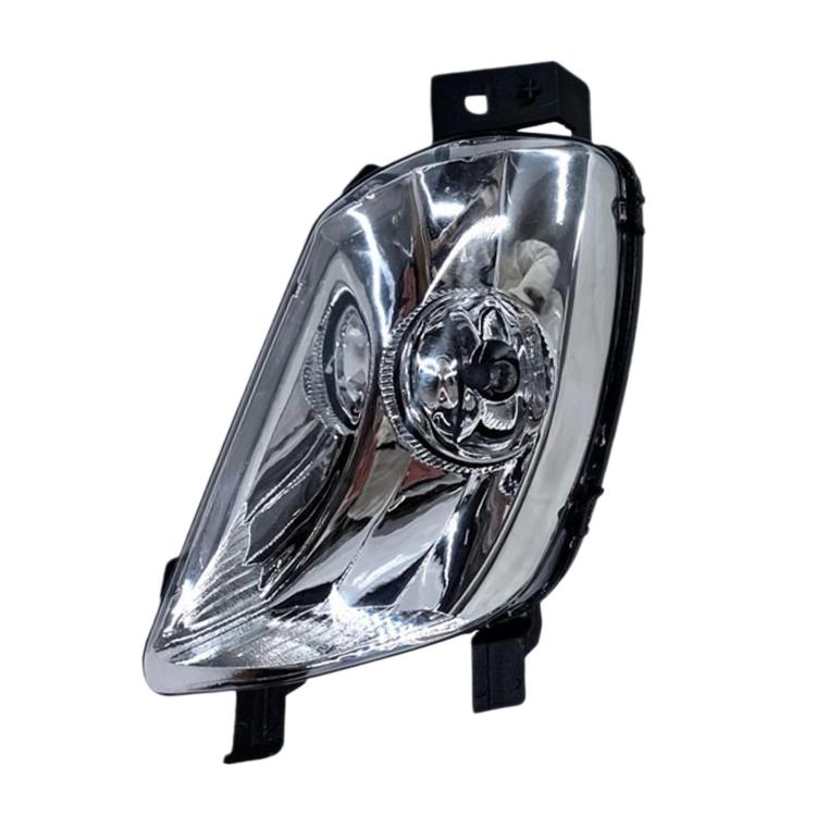 Front fog light assembly with clear lens, chrome reflector, and black housing tabs