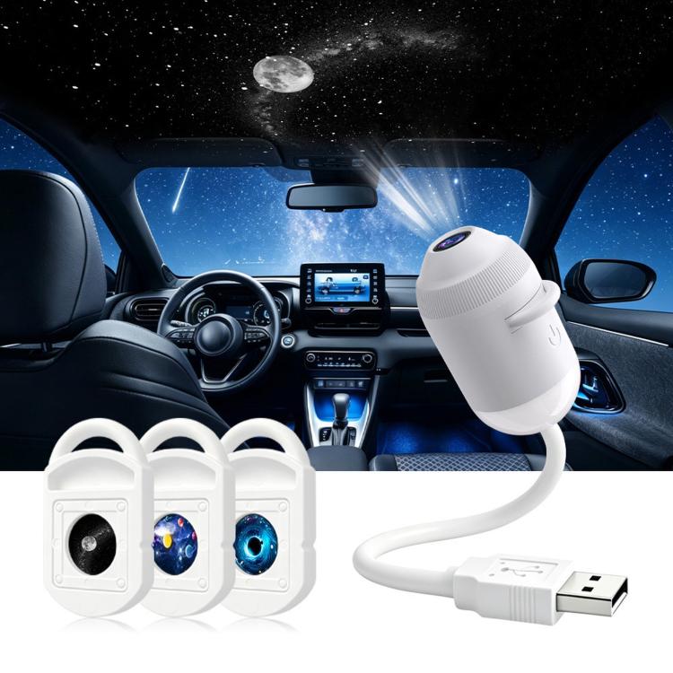 White star projector night light with multiple lens cartridges and USB cable