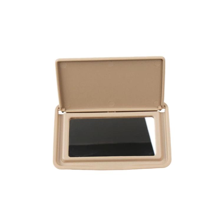 Beige sun visor vanity mirror with open lid, black mirror window