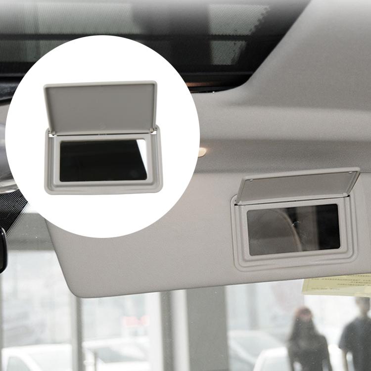 Gray sun visor vanity mirror close-up on car visor with open lid