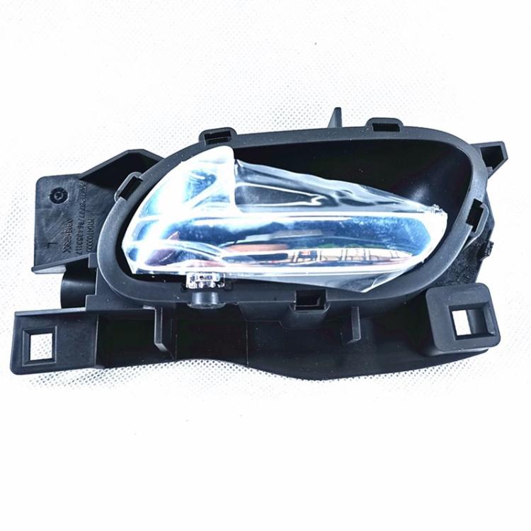 Car interior door handle assembly with black bezel and chrome lens