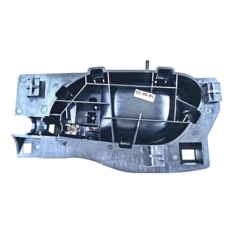 Car interior door handle housing with internal components and mounting brackets