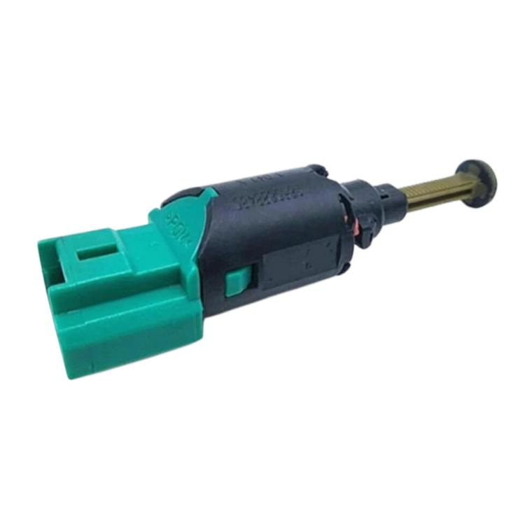 Brake light switch, green plastic connector with black cylinder and protruding metal rod
