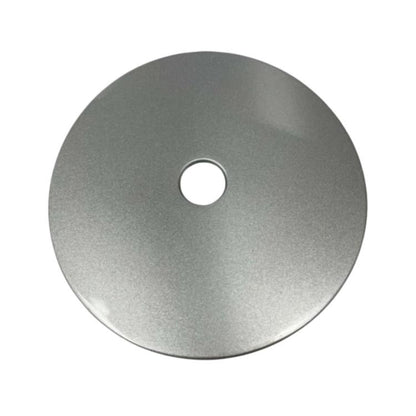 Fuel tank outer lock cover, round metal disc with central hole, brushed gray finish