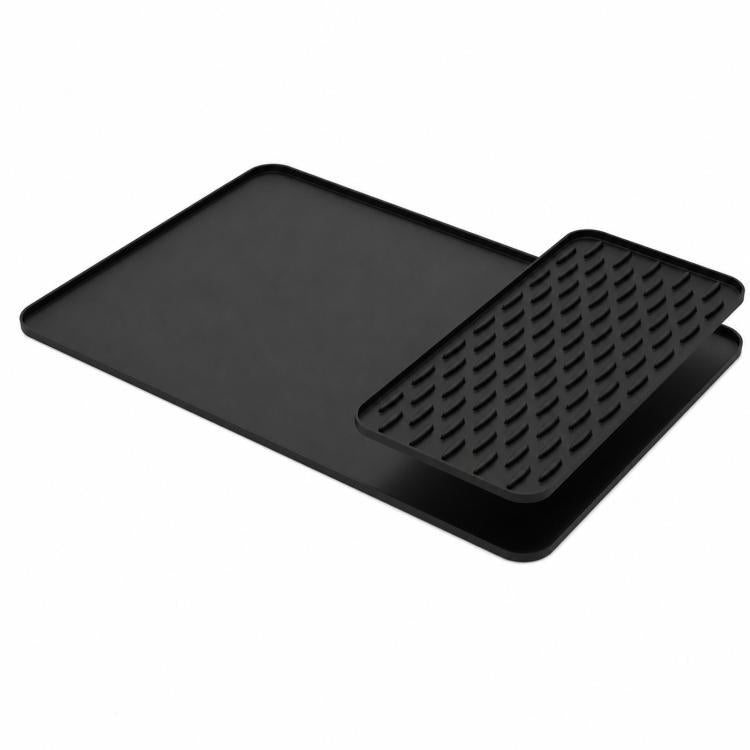 Black silicone countertop draining mat with raised edge and textured removable insert