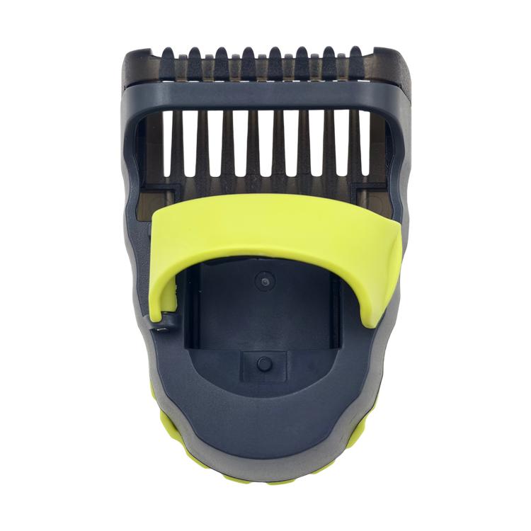 Adjustable guide comb close-up, dark frame with lime green top cover and teeth