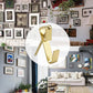 Gold picture hanging hooks shown in a home gallery wall display, 130-piece kit