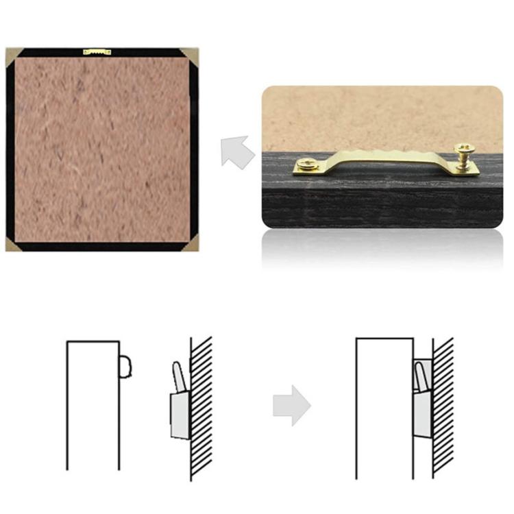 Gold sawtooth picture hook with screws, mounted on a frame edge