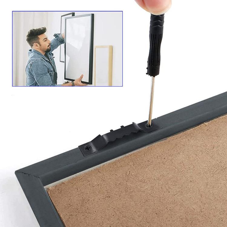Black sawtooth picture hook being screwed onto a frame backing strip