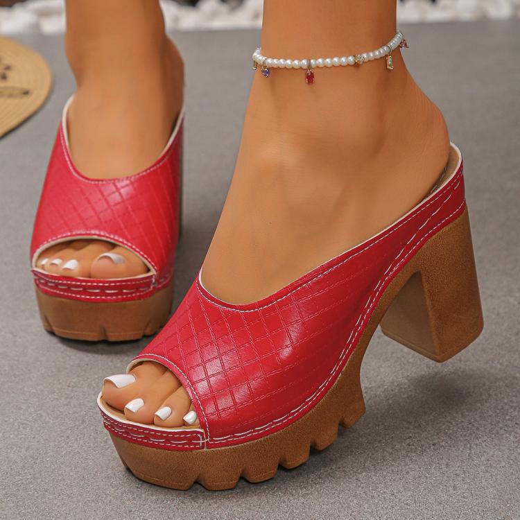 Red peep-toe platform mules with high block heel, chunky tread outsole, slide opening