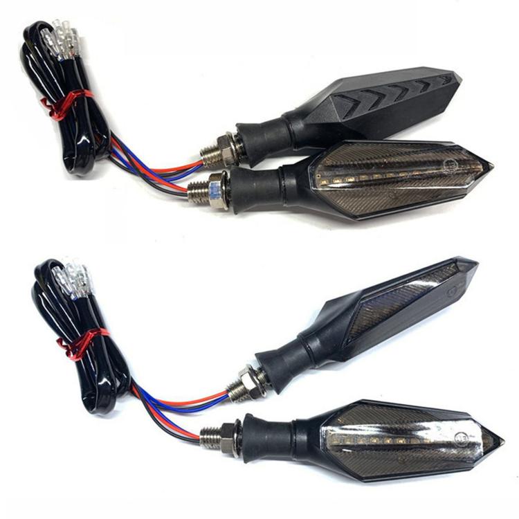 Motorcycle LED turn signal pair with wiring harness and dark arrow-shaped housings