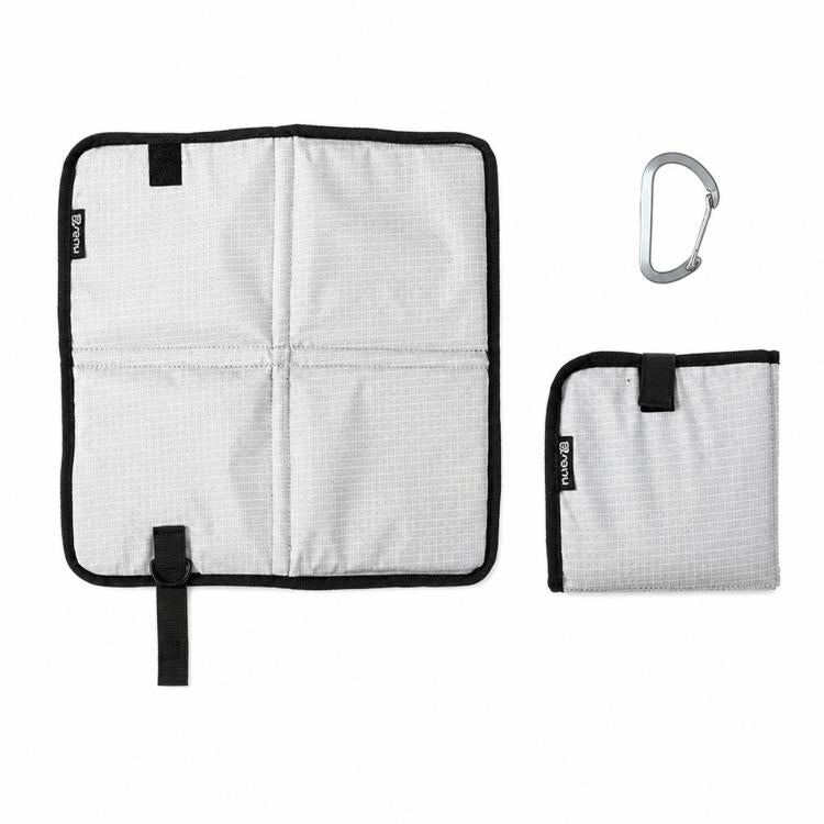 White foldable camping seat pad with carabiner, square foam mat with carrying tab
