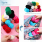 Small crochet yarn balls in multiple colors with hooks and floral storage bag