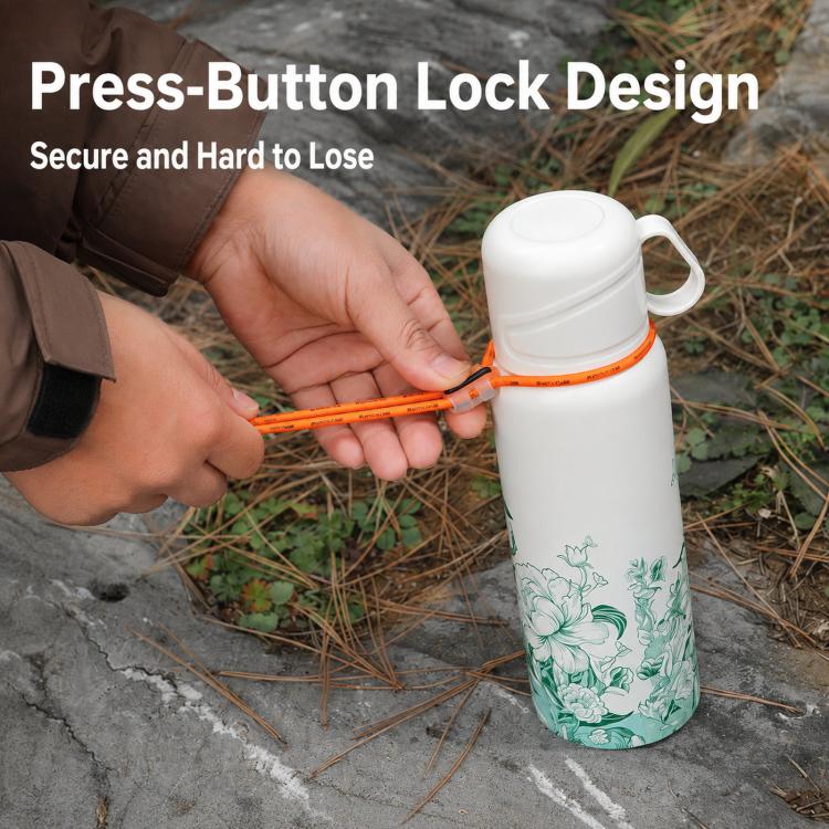 Orange bungee tie-down strap securing a white water bottle to outdoor gear