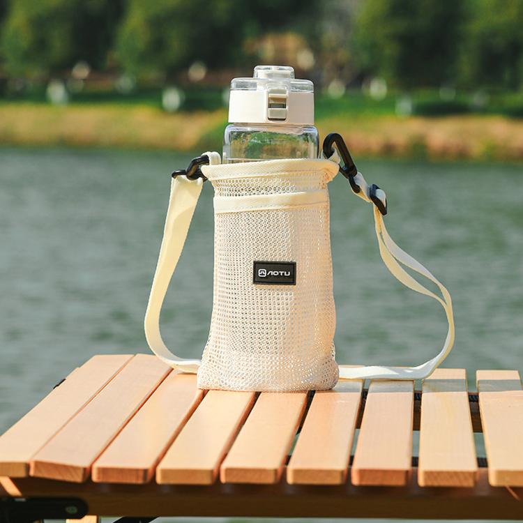 Cream mesh water bottle holder bag with adjustable shoulder strap and front pocket