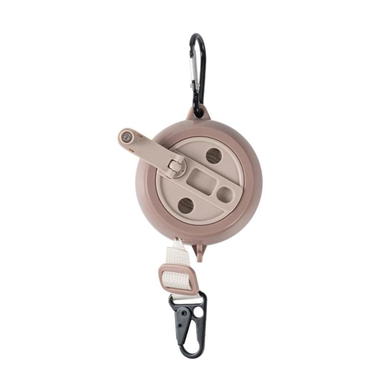 Retractable clothesline reel with beige housing, webbing strap, and carabiner hook