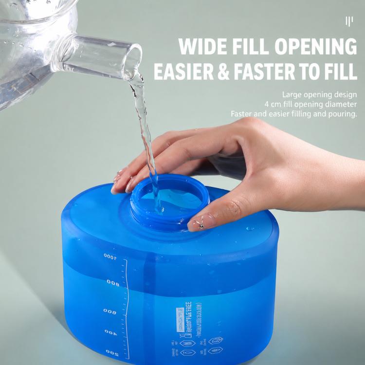 Collapsible blue TPU water bottle with wide open cap while filling.