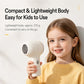 Compact white cordless baby hair dryer with side control button and rounded head