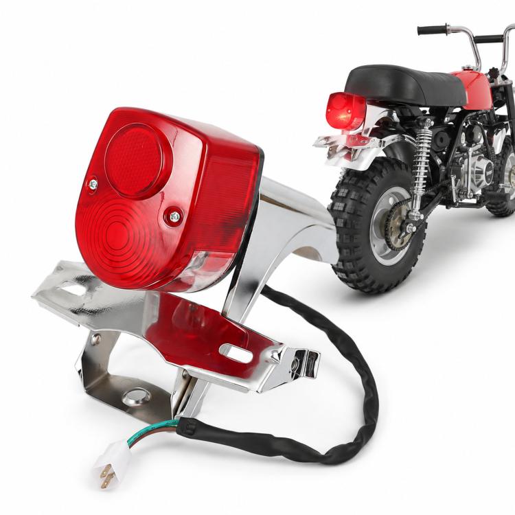 Rear brake tail light assembly with red lens and chrome bracket, includes wiring harness