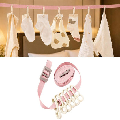 Pink portable clip clothesline with six clips, shown holding small garments