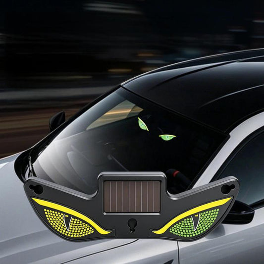 Triangular car window LED decorative light with green and yellow evil-eye glow and solar panel