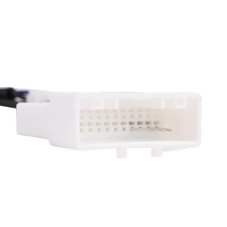 White 24-pin connector housing on backup camera wiring harness adapter