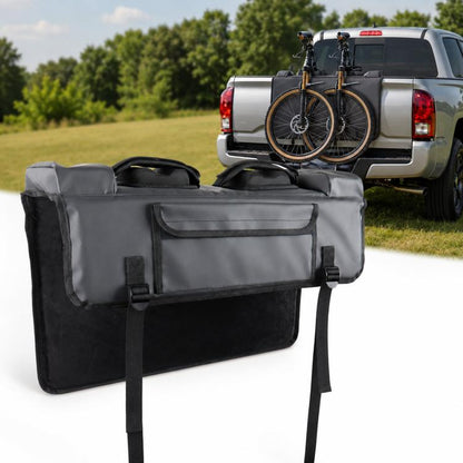 Tailgate bike protection pad with two cushioned compartments and strap closures