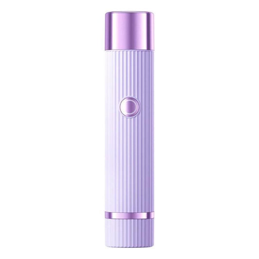 Cordless electric body hair trimmer in purple with ribbed handle and round power button