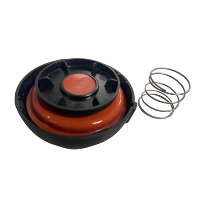 Car valve cover cap with orange insert, black housing, and metal return spring