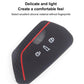 Black silicone key fob cover with red trim, honeycomb side, and key icons
