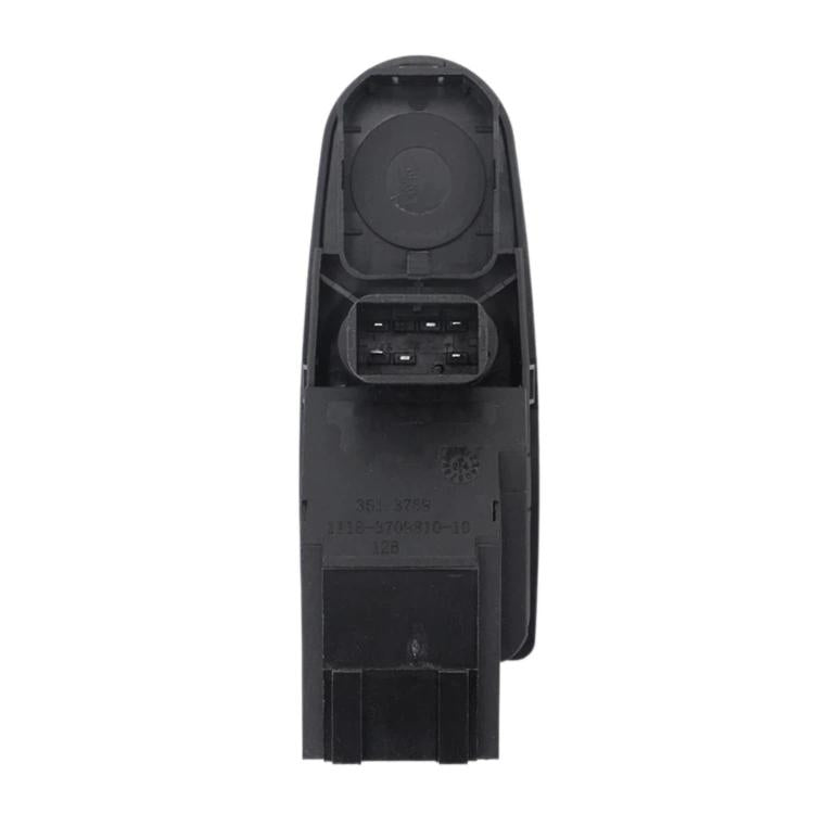 Window lift switch underside showing large circular cover and mounting tabs