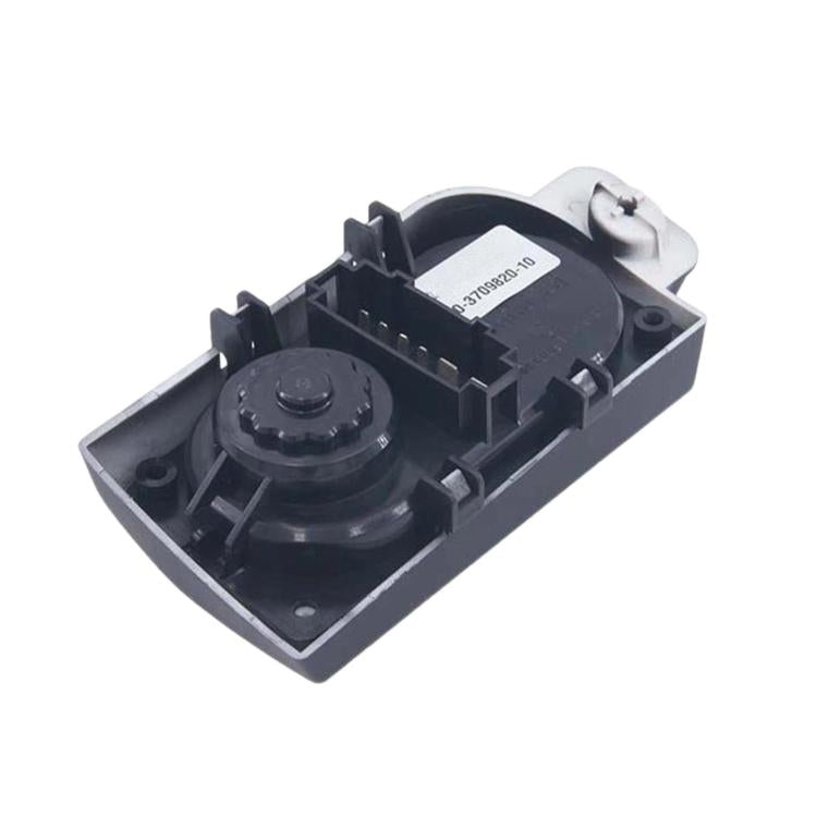 Headlight height adjustment switch housing, exposed internal mechanism in black plastic