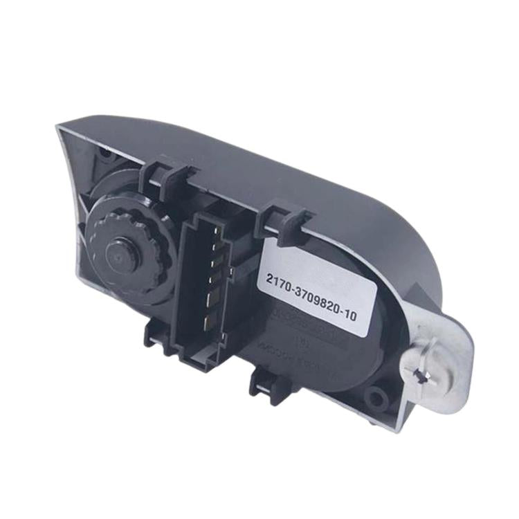 Headlight height adjustment switch actuator with metal screw and label on black housing