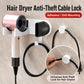 Wall-mounted cable lock holder securing a hair dryer with a routed power cord