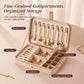 Beige velvet jewelry box open with organized compartments for rings, bracelets, and earrings