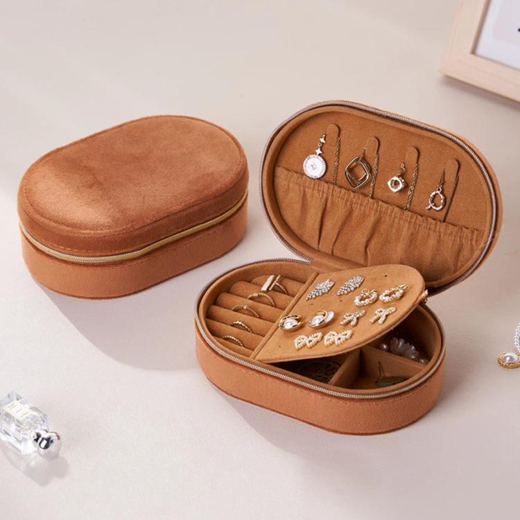 Brown velvet oval jewelry case with zipper, open earring board and ring compartments