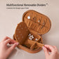 Brown velvet oval jewelry case with zipper, open with divider trays and earring panels
