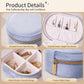 Light blue velvet oval jewelry case with zipper, open earring hooks and divider storage