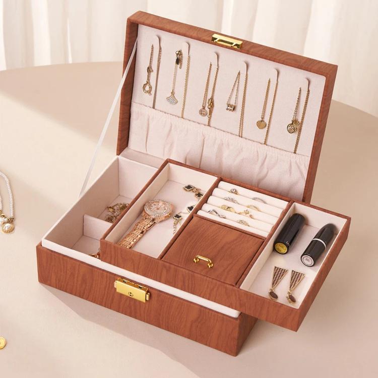 Brown wood-grain jewelry box open with two layers and earring organizer slots
