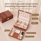 Brown wood-grain jewelry box open with organized sections for rings, bracelets, and earrings