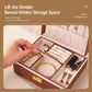 Brown wood-grain jewelry box with lifted divider revealing hidden storage compartment