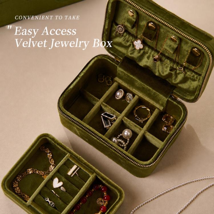 Emerald green velvet travel jewelry box with double zipper, open with ring, earring and bracelet slots