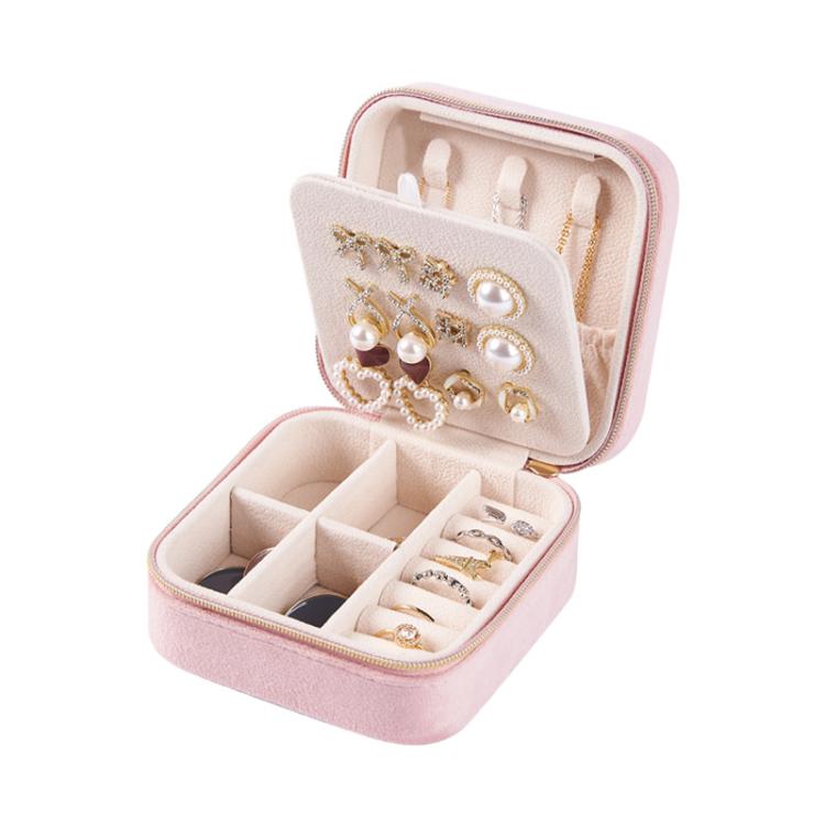 Mini velvet travel jewelry box in pink, open with ring areas and necklace hooks