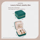 Mini velvet travel jewelry box with velvet exterior and open divider trays, size shown