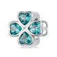 Sterling silver four-leaf clover bead charm with teal heart-shaped crystals